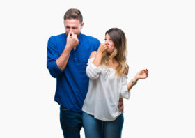 young couple reacting to a bad smell